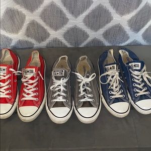 3 pairs of low top converse that have been worn.